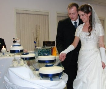 Bride Cutting Homemade Wedding Cake