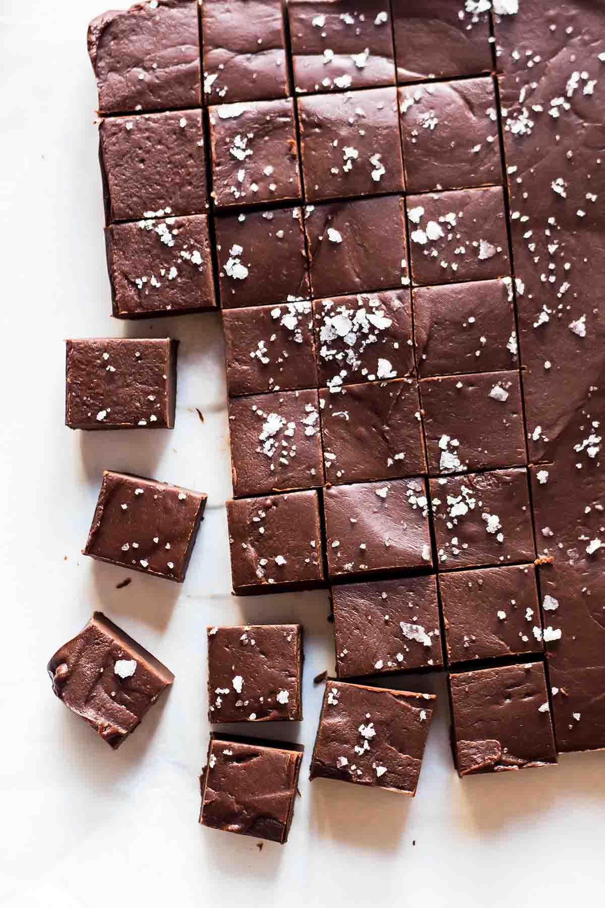 salted chocolate fudge square on parchment paper