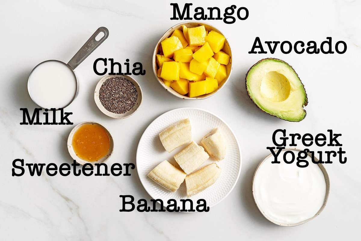 mango avocado smoothie ingredients laid out on counter