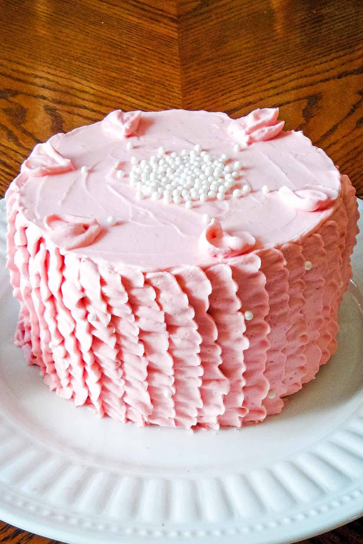 cake with pink ruffle frosting