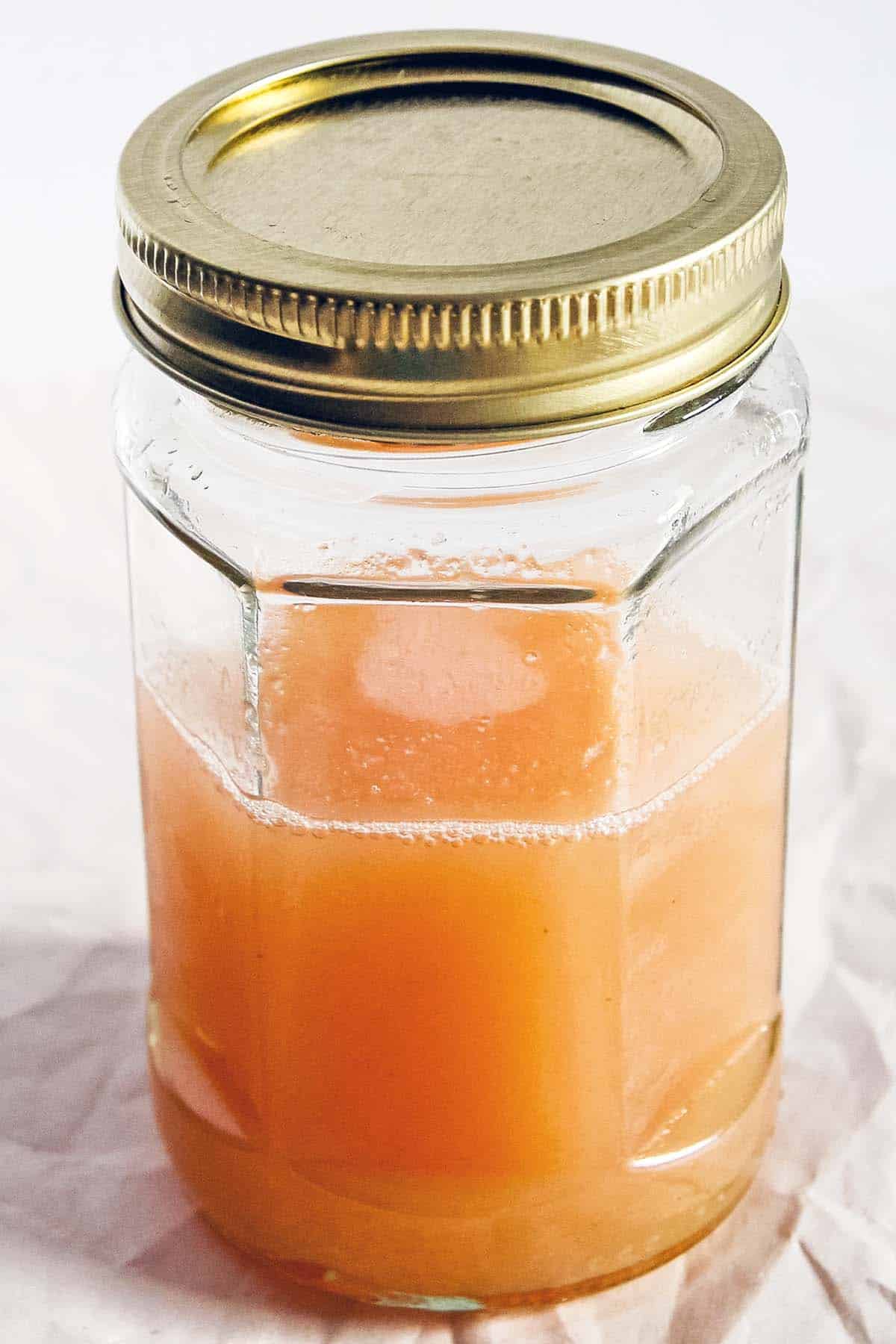 homemade rhubarb syrup in glass jar