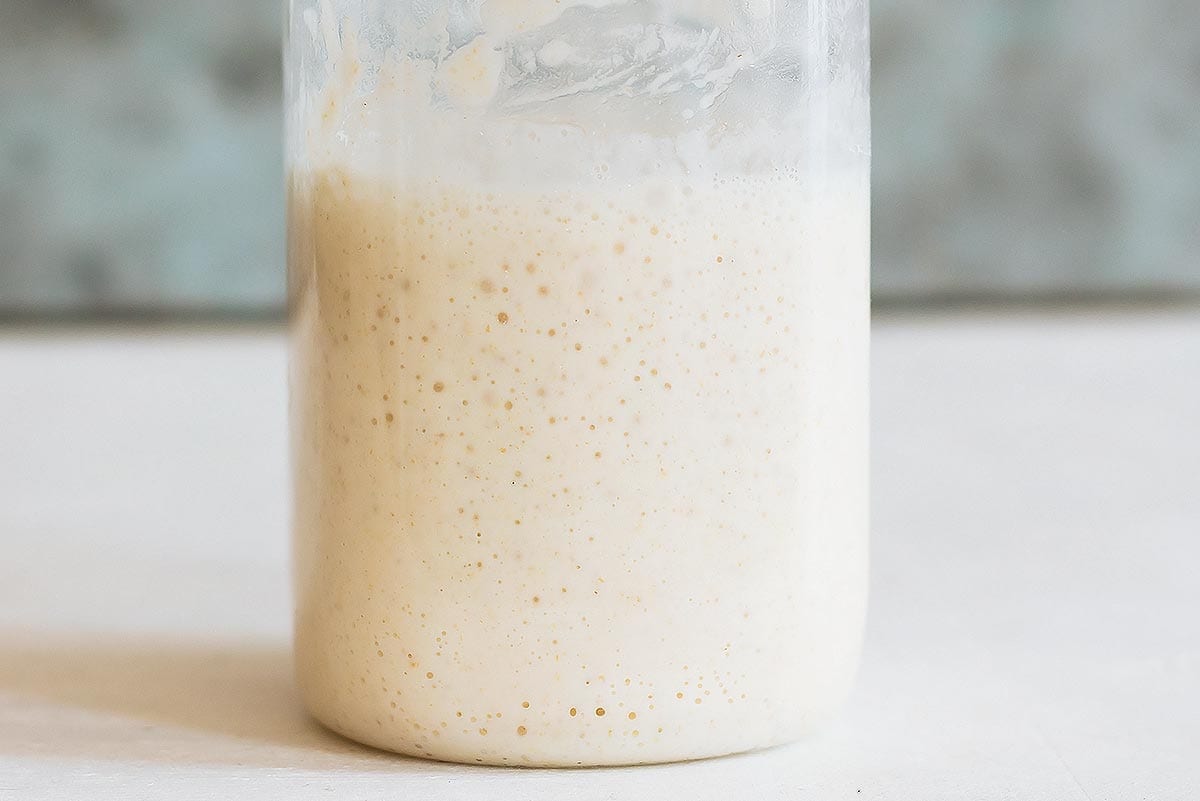 Bubbly sourdough leaven in jar
