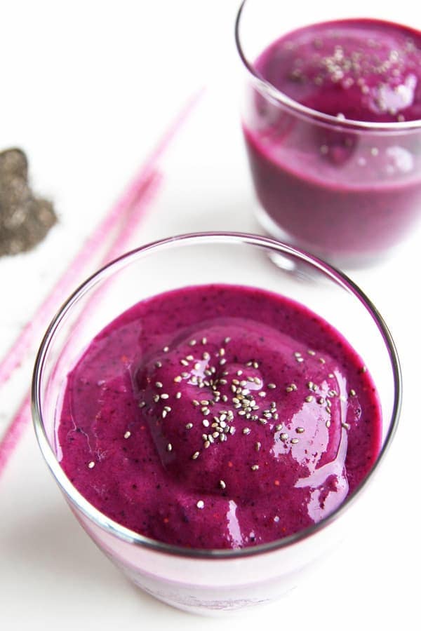 two glasses with magenta pink beet smoothie