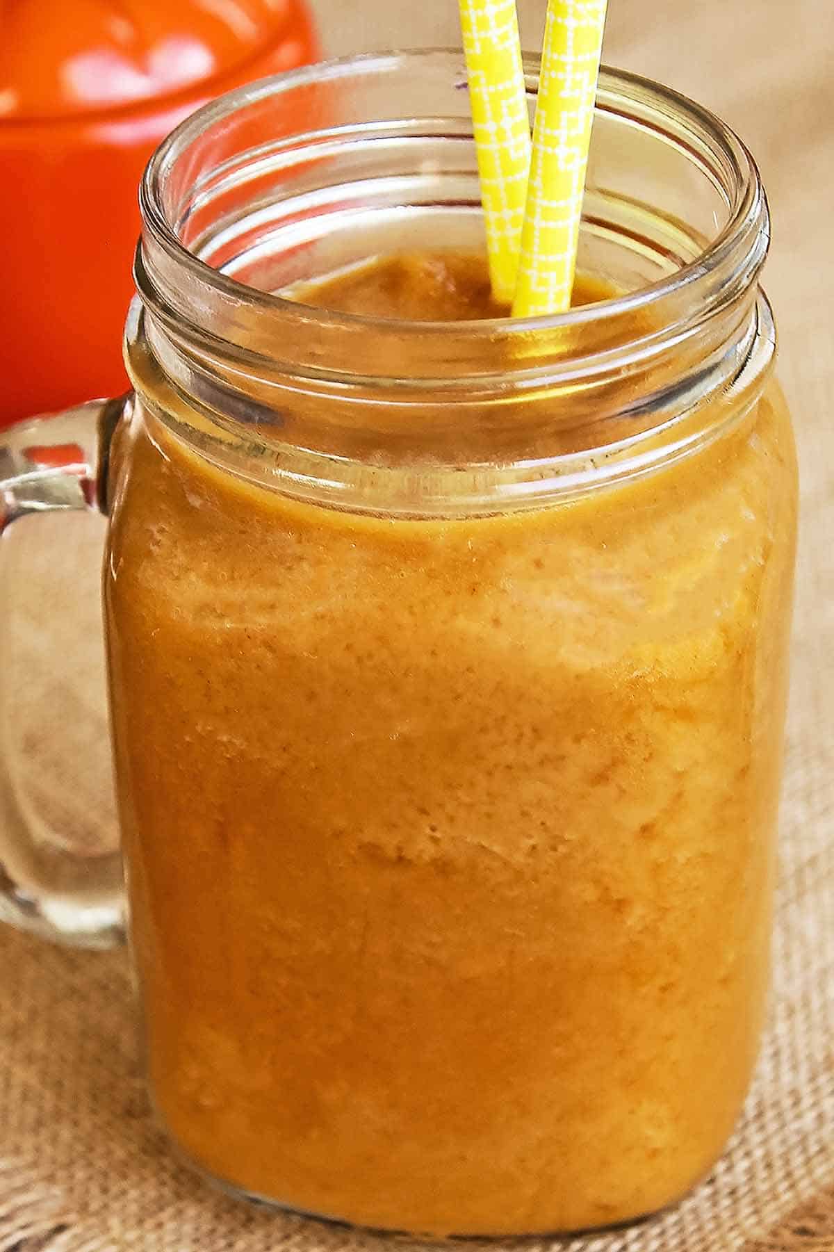 pumpkin spice frappe with out cream topping in mason glass mug with handle