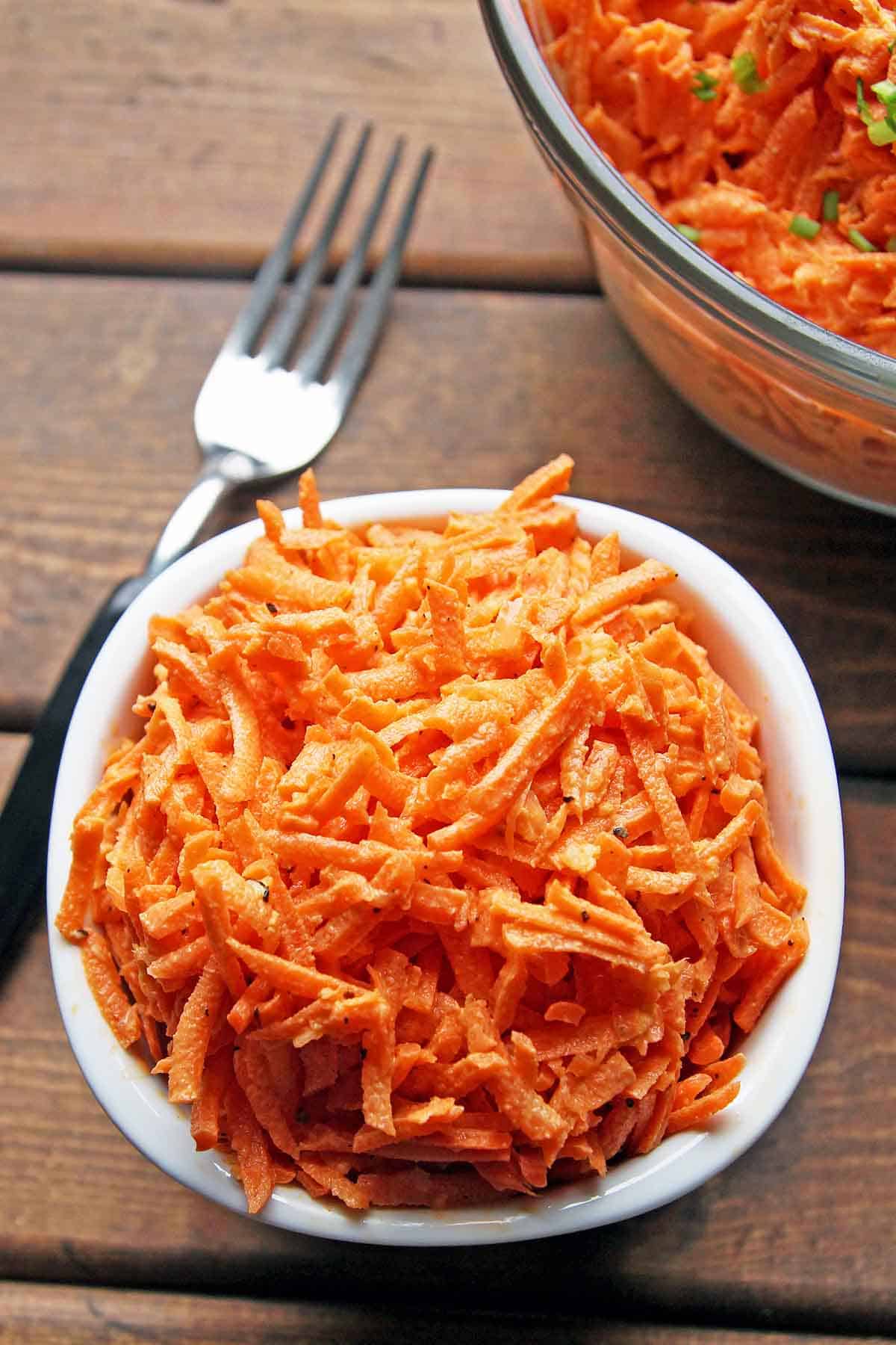 small white bowl with carrot salad