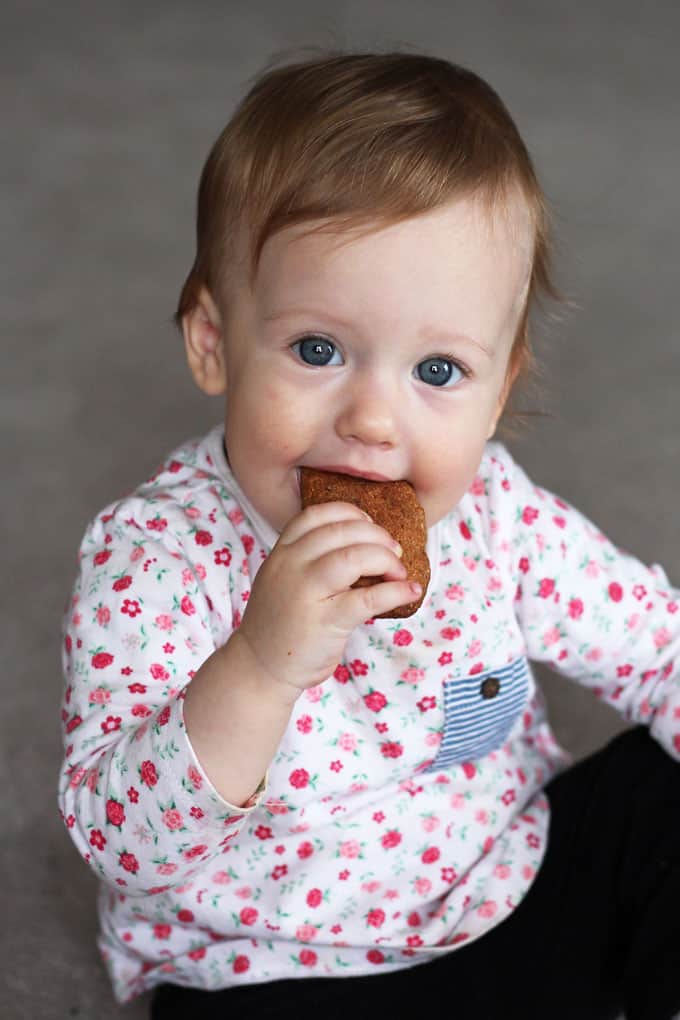 Baby with teething biscuit