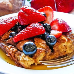 overnight french toast on plate with berries