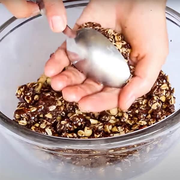 shaping no bake cookie dough with spoon and hands