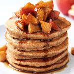 stack of applesauce pancakes with diced apple caramel topping