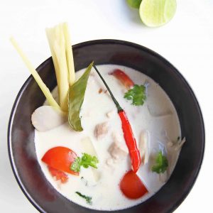 Tom Kha Gai - Thai Chicken Coconut Soup is one of the most popular Thai dishes. Galangal root, lemongrass and kaffir lime leaves are infused in a coconut milk broth, with chicken, mushrooms and hot chilies. The aromatic soup makes a delicious main course served alongside steamed rice.