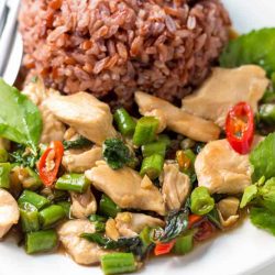 Thai Basil Chicken Stir Fry is a quick and easy dish that is incredibly flavorful. Served alongside steamed rice it's perfect for weeknight dinners - much better and faster than take-out.