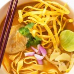 This is an easy recipe for Khao Soi - a Northern Thai Coconut Curry Soup with Egg Noodles and Chicken. It is an amazingly balanced dish with spicy, sweet, creamy, and crispy elements.