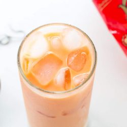 This refreshing Thai Iced Tea with Milk is perfect to accompany a spicy Thai food dinner. This homemade recipe uses palm sugar and coconut milk in place of evaporated and sweetened condensed milk to make it dairy free.