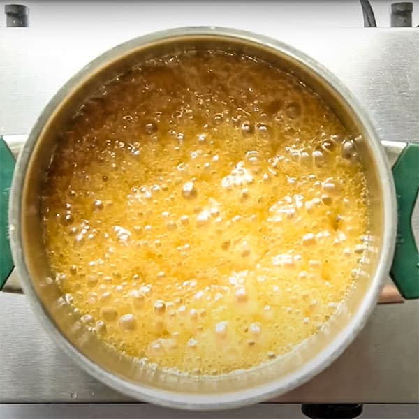 bubbly vegan caramel simmering in pot