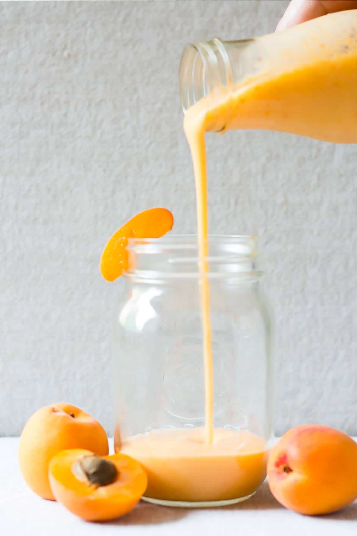 Pouring Apricot Almond Milk Smoothie