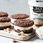 These Frozen Dessert Cookies Sandwiches are a perfect vegan treat. Creamy frozen cashewmilk is layered in between flourless cashew chocolate cookies for a delicious summer dessert.