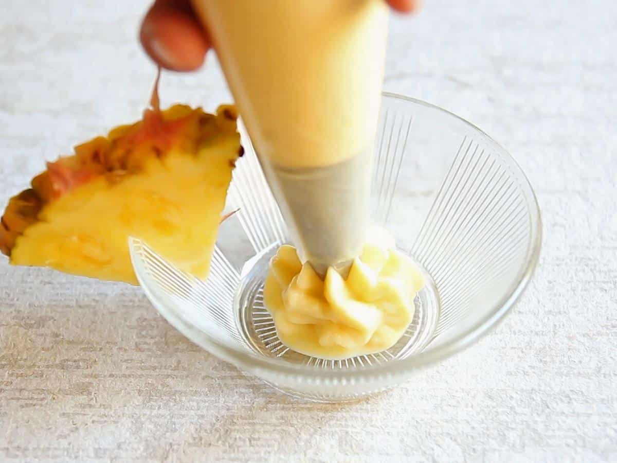 Piping Pineapple Whip in Bowl