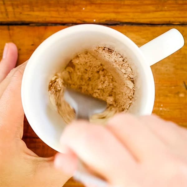 whisking dry ingredients in mug