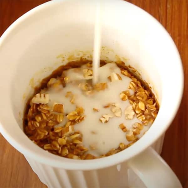 milk pouring over baked oatmeal