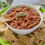 Easy Homemade Salsa in bowl with tortilla chips on plate