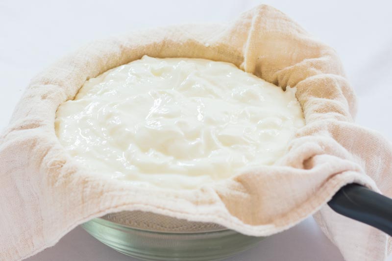 Straining Yogurt Through Cheesecloth