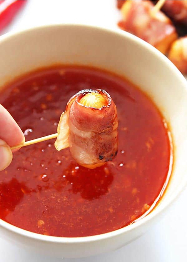 Dipping Bacon-wrapped Hot Dog