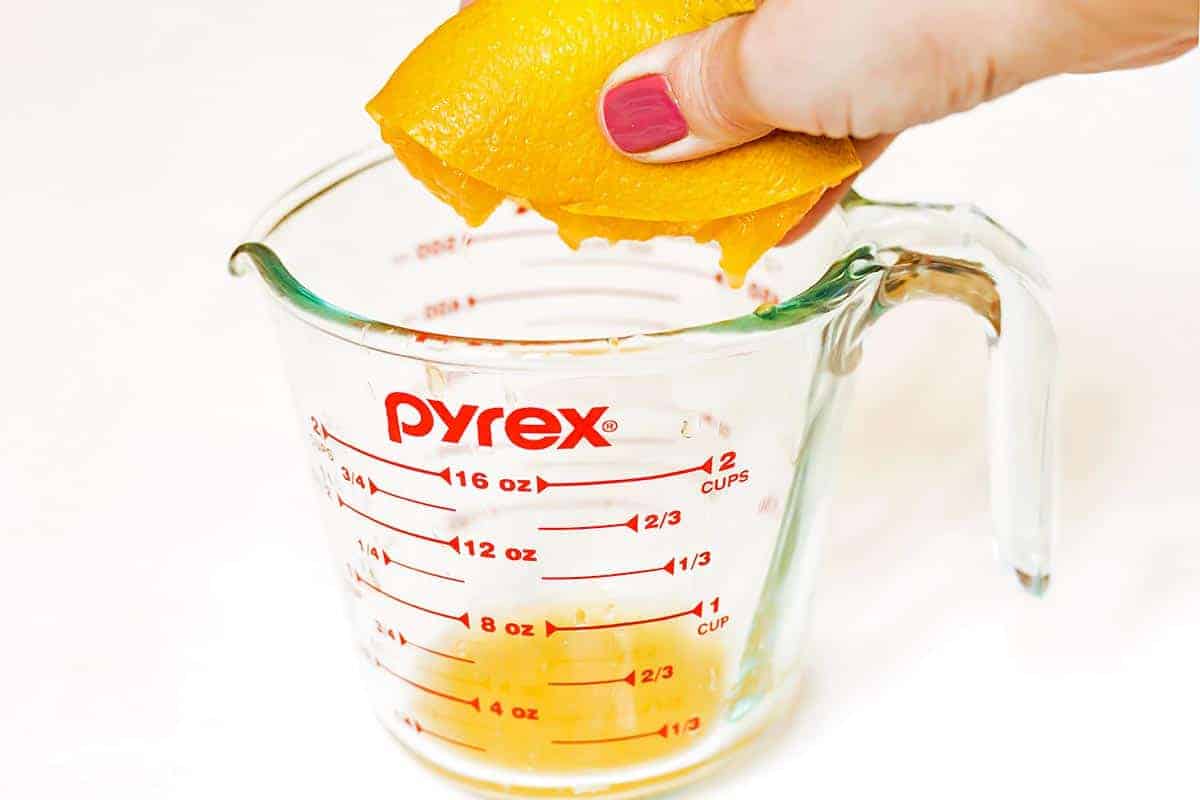 Hand Squeezing Orange Juice