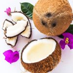 Fresh coconuts with purple flowers