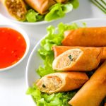 Plate of Thai spring rolls with sweet chili sauce