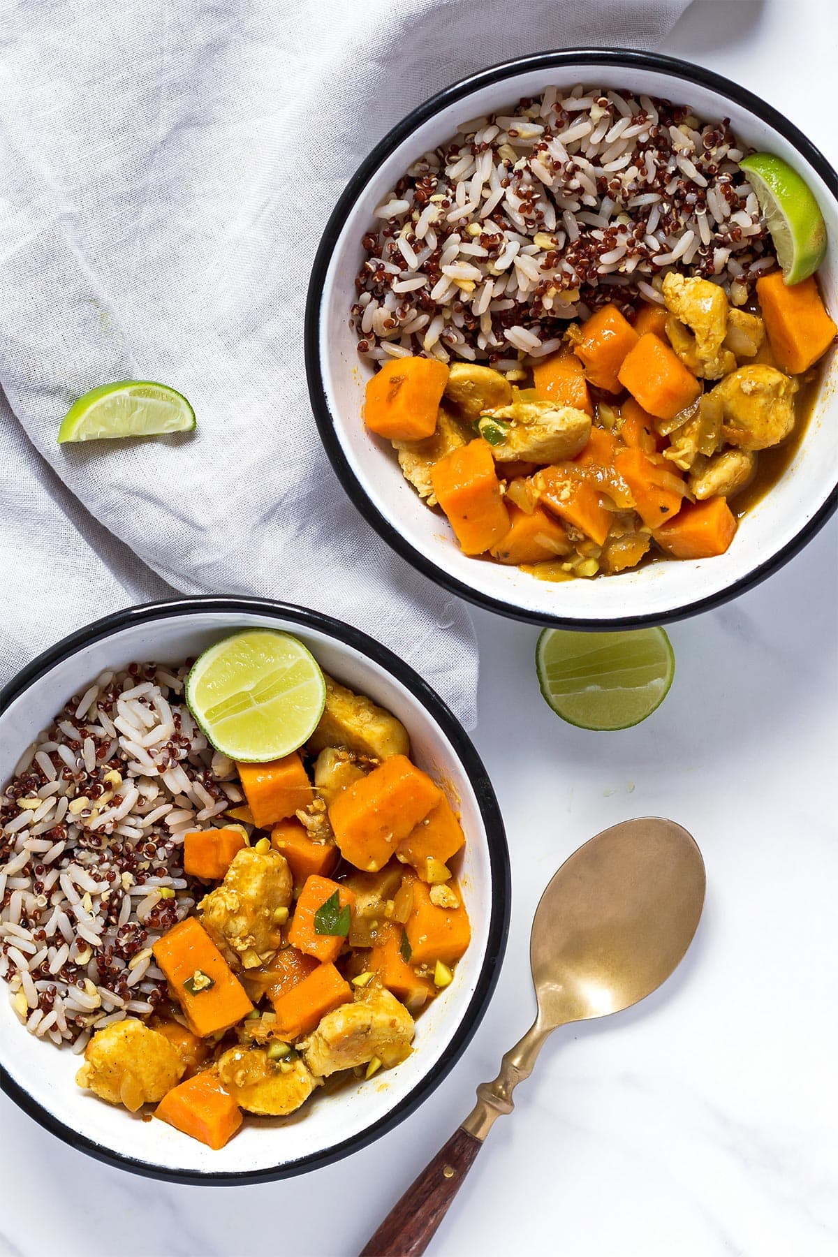 Two bowls of sweet potato curry and rice