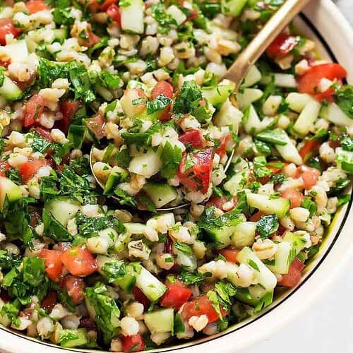close up of tabbouleh salad with barley tomatoes and cucumber