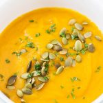 Butternut Squash Soup in bowl with pumpkin seed topping