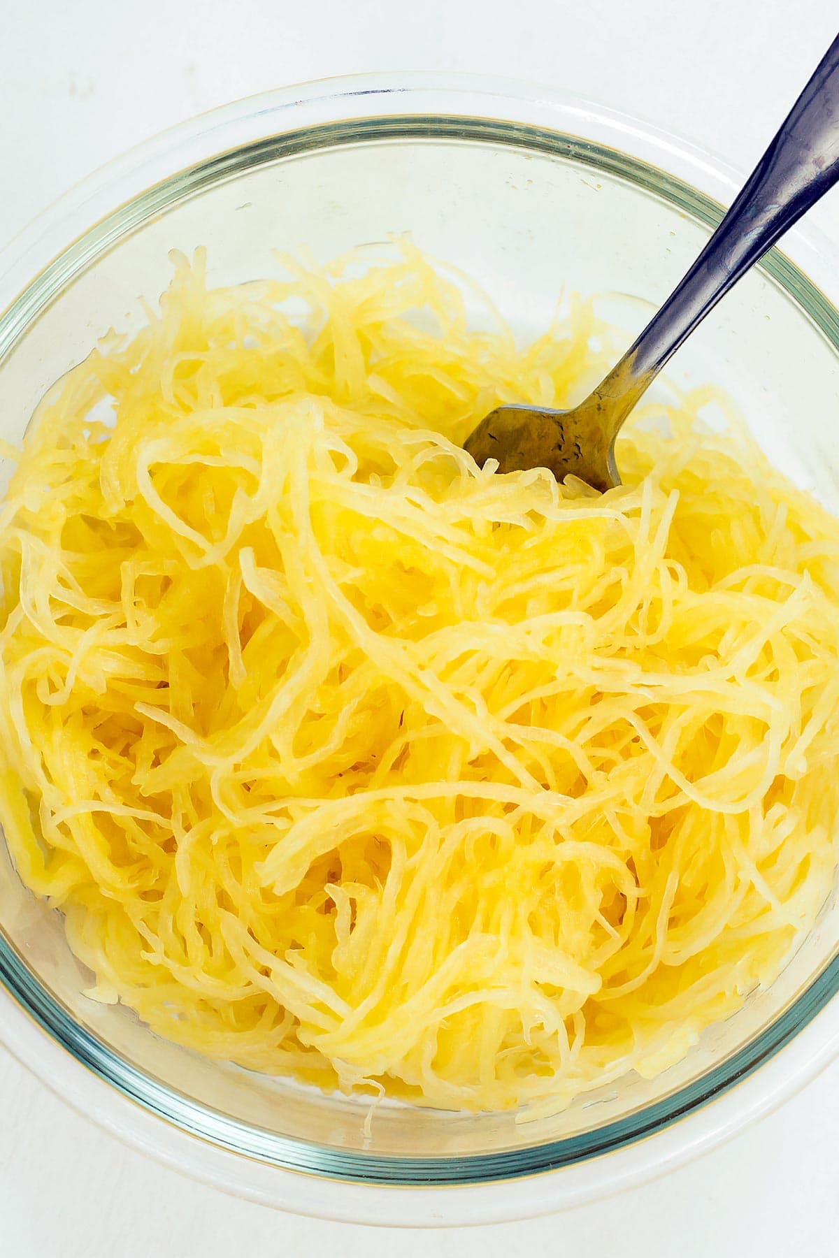 Cooked spaghetti squash noodles in bowl