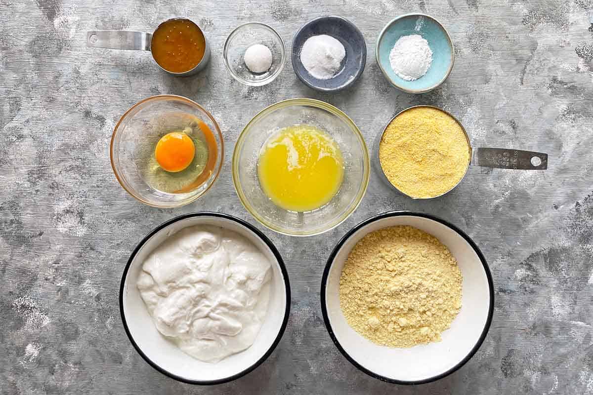 ingredients for cornbread laid out in individual bowls