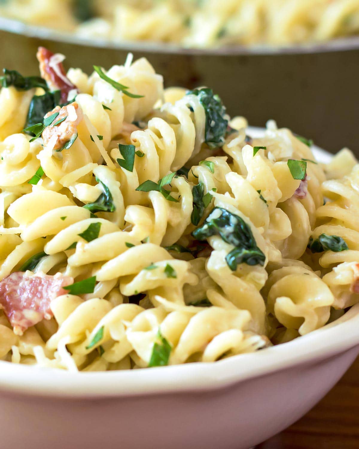 Creamy spinach pasta in bowl