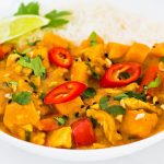 Peanut Butter Chicken Curry with sweet potatoes and sliced red chili topping