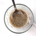 Chia Egg mix with spoon in small glass bowl