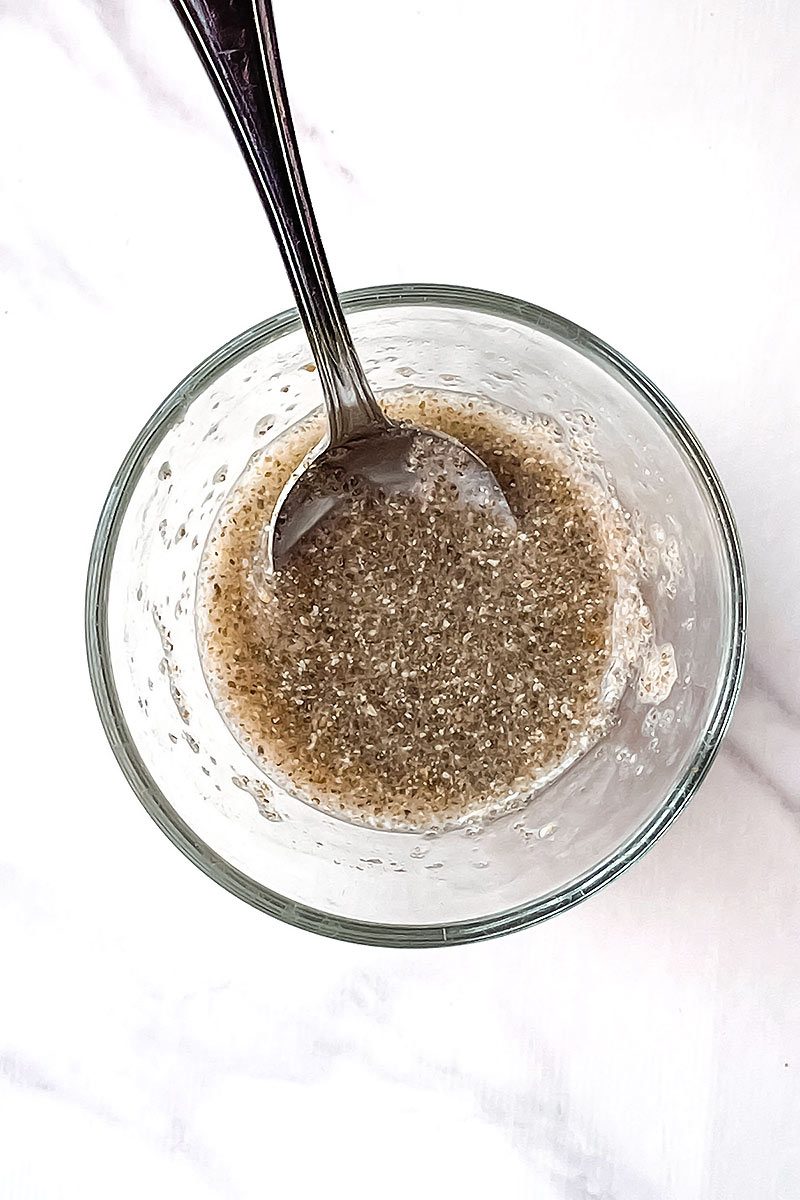 Chia Egg mix with spoon in small glass bowl