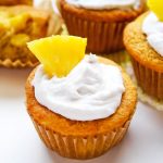 Piña Colada cupcakes with whipped coconut cream and pineapple wedge topping