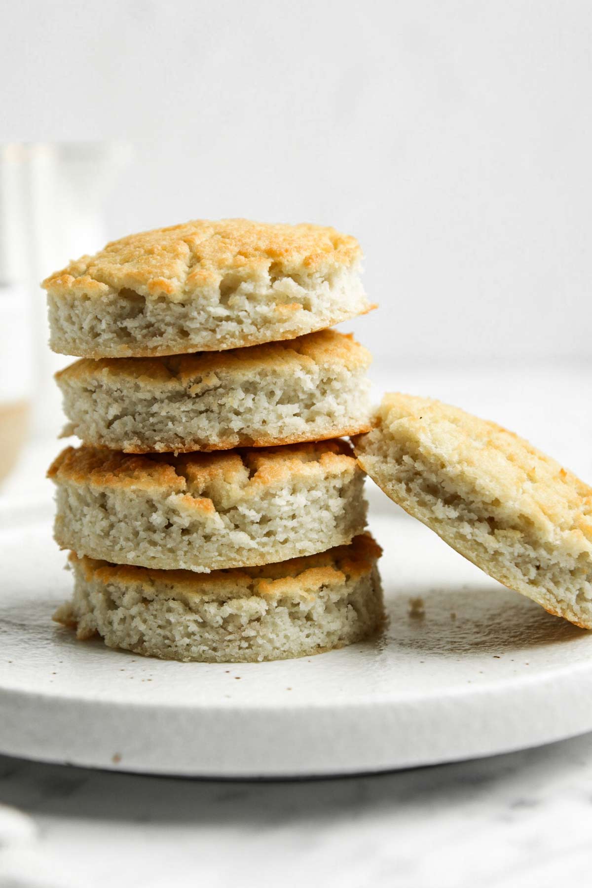 Coconut Flour Biscuits stacked on small white plate