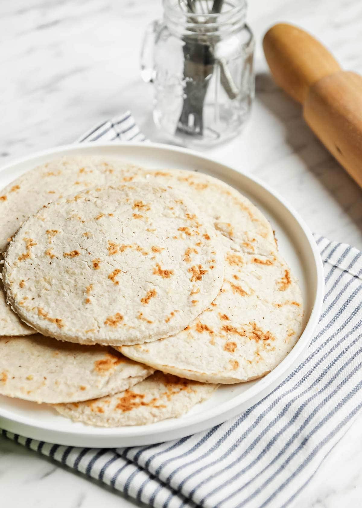 Low carb flour tortillas spread out on a plate
