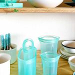 Teal Ziptop containers in shelf with other white and teal containers