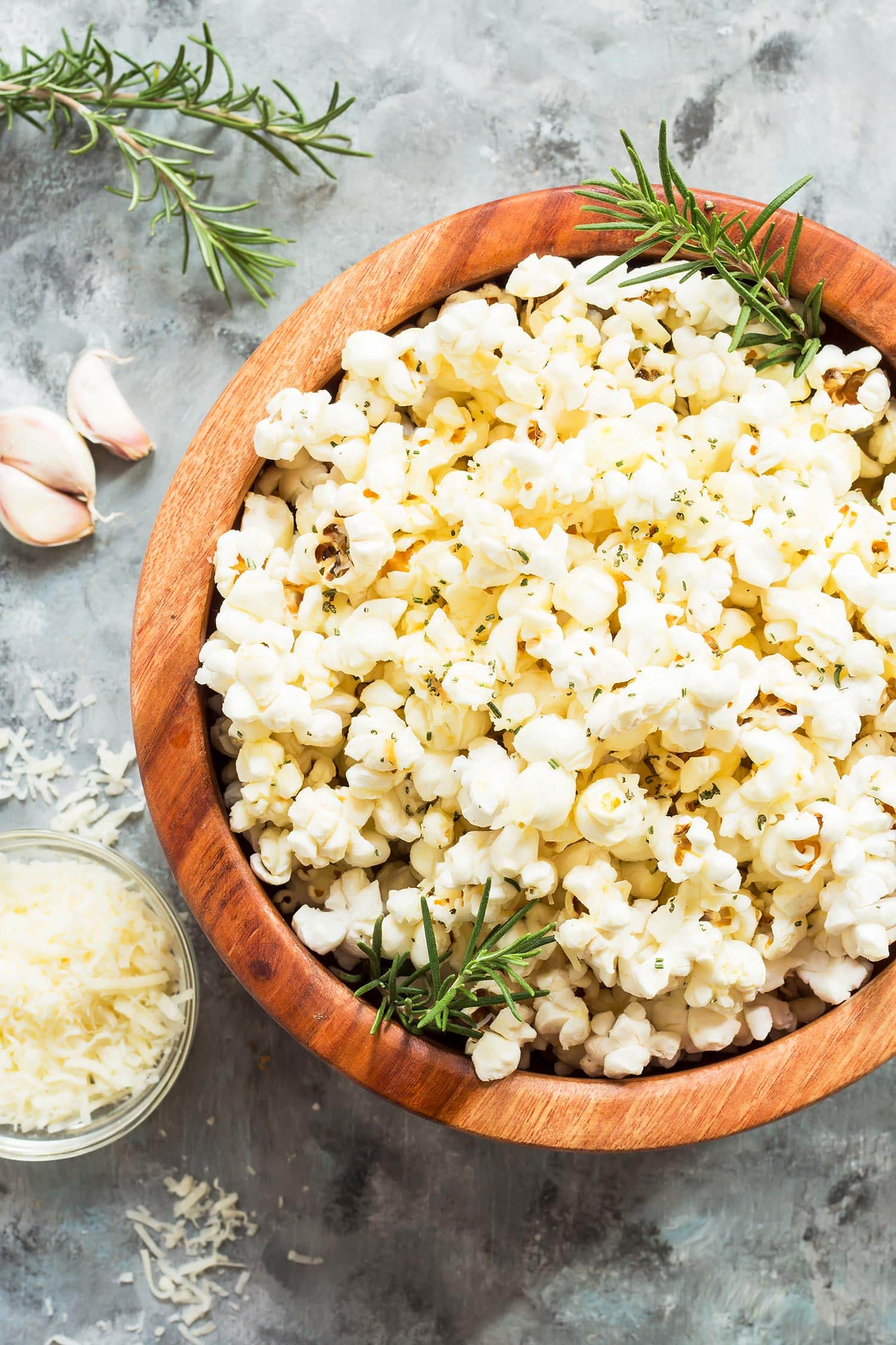 Rosemary parmesan popcorn in wooden bowl