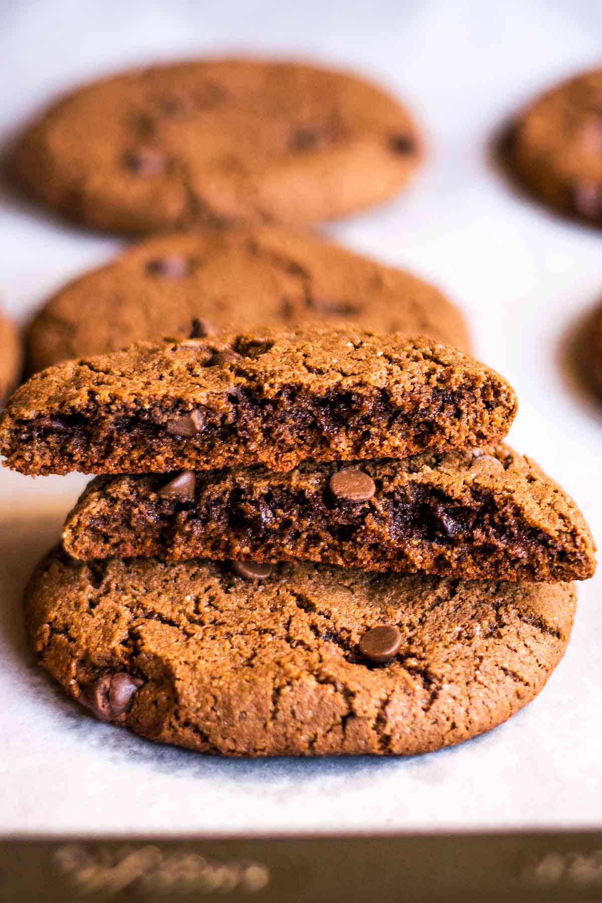 Double chocolate cookies broken in half to reveal texture inside