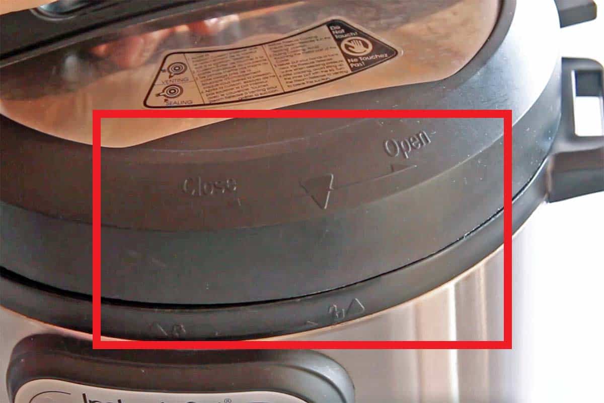 Instant Pot lid closeup of arrows to line up for easy closing