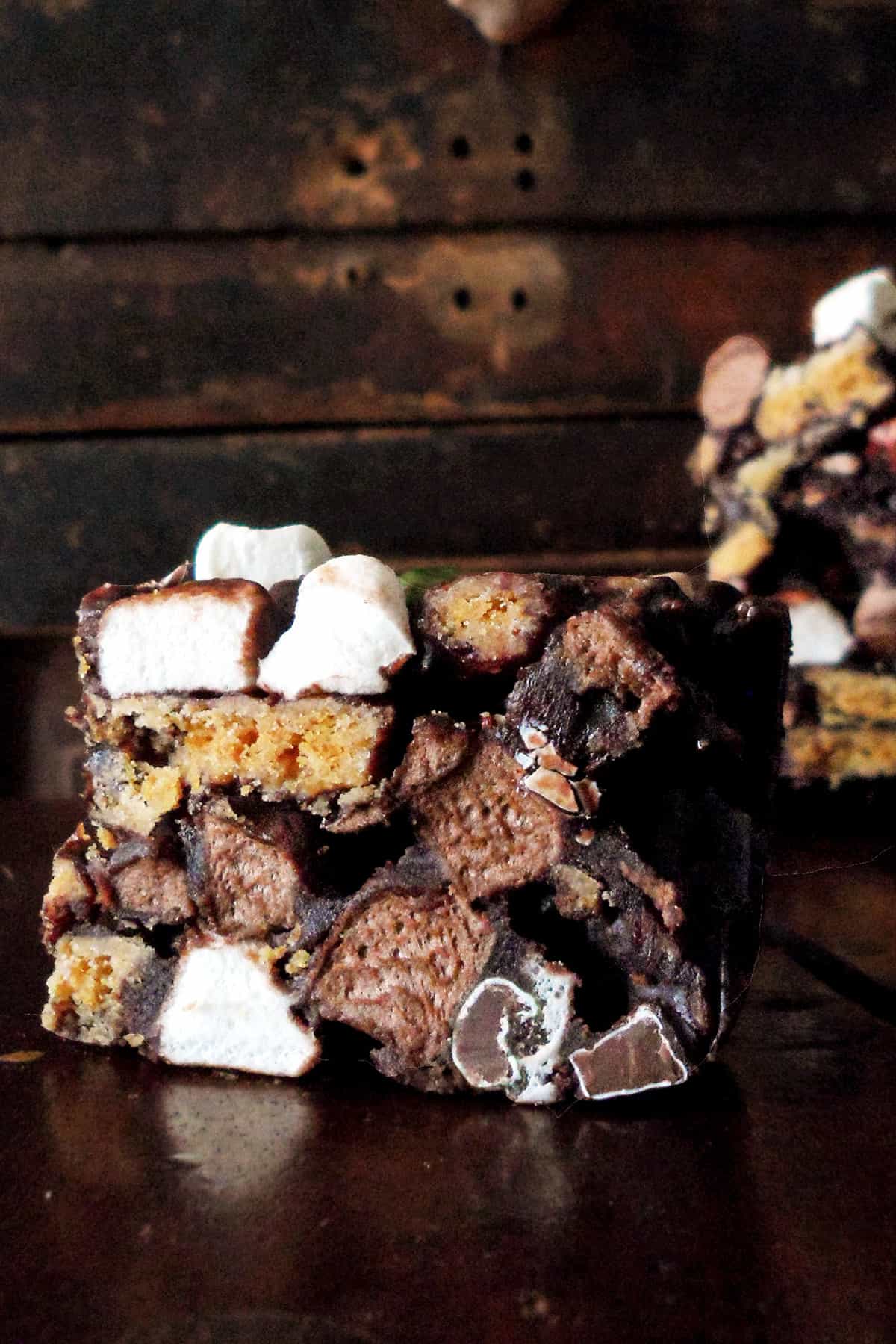 close up of rocky road bars, marshmallows, biscuits and chocolate candy showing in cross section