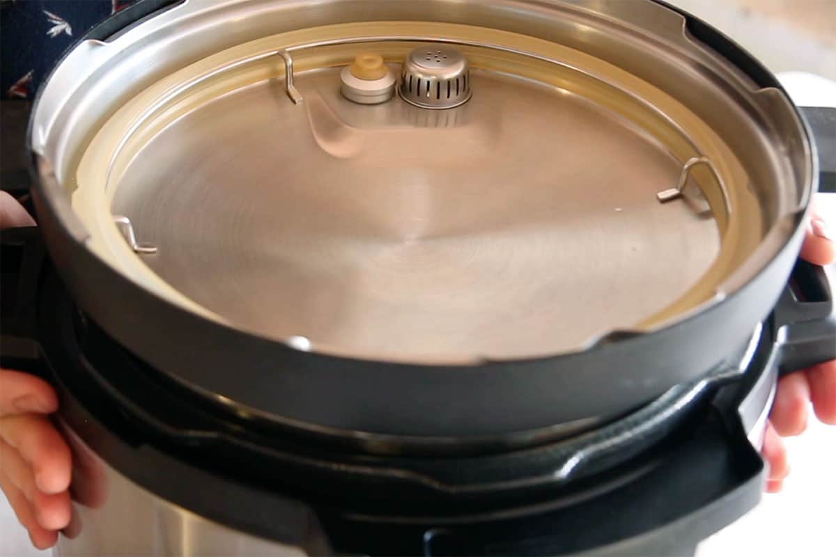 instant pot lid placed upside down on the pressure cooker