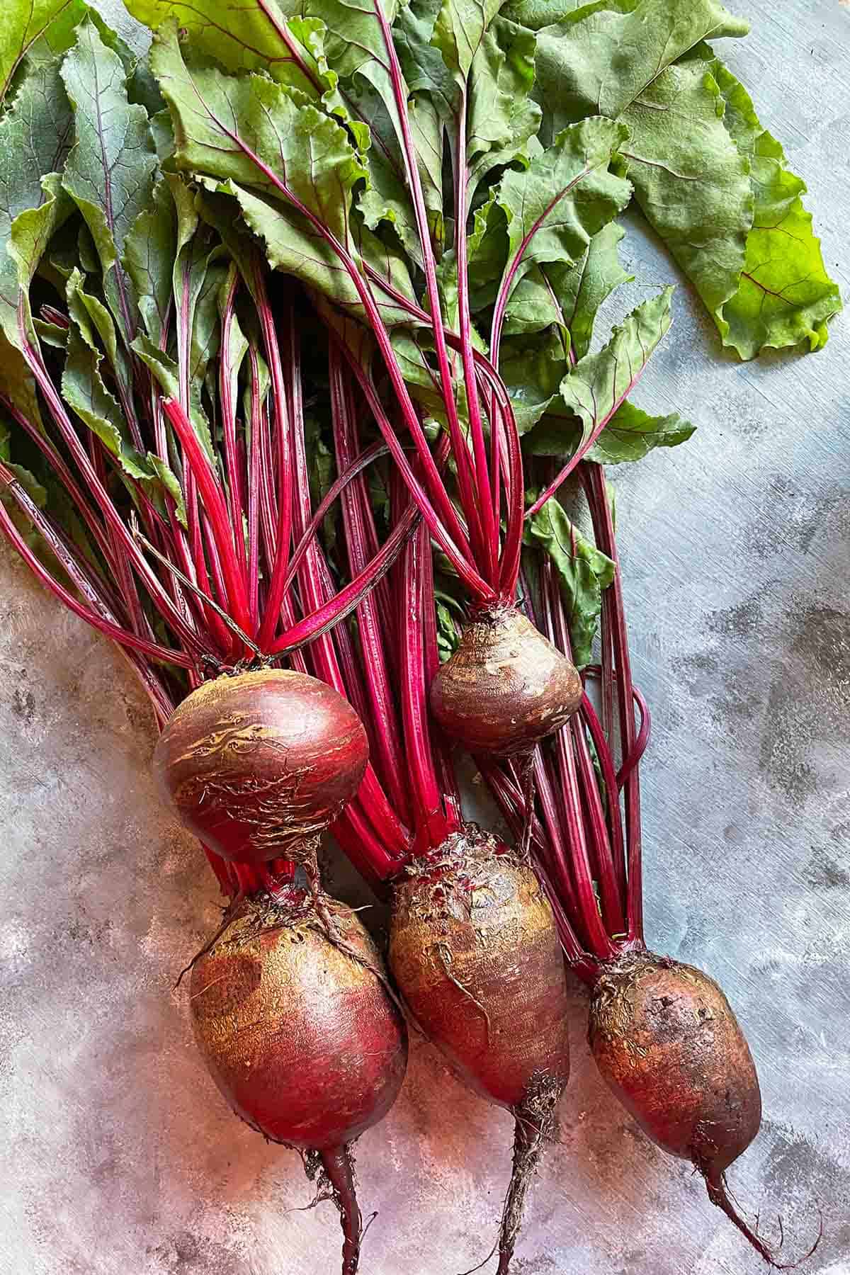 5 garden fresh beets with greens attached