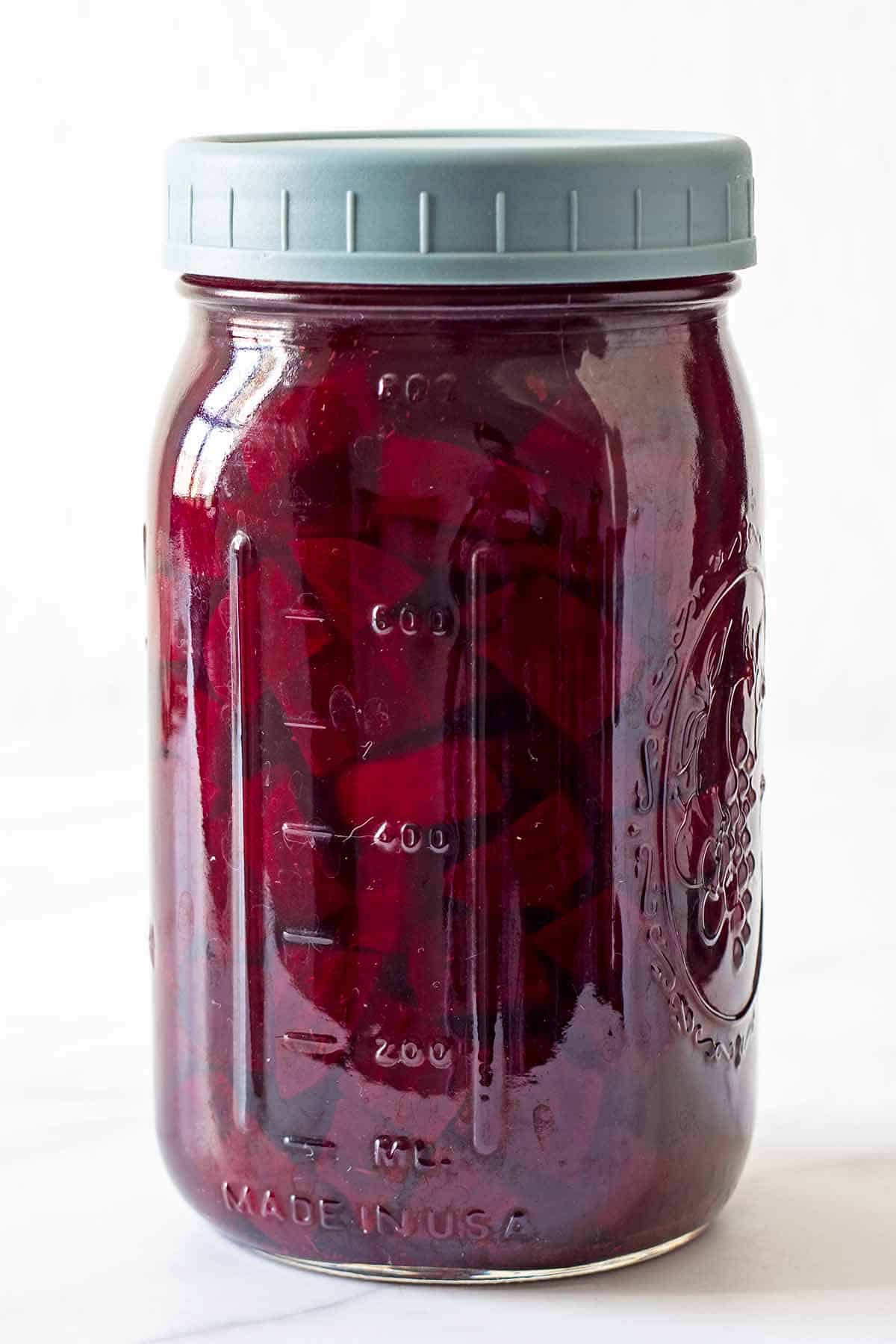 pickled beetroot in glass jar with grey lid