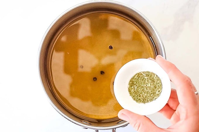 small sauce pan with pickle brine ingredients